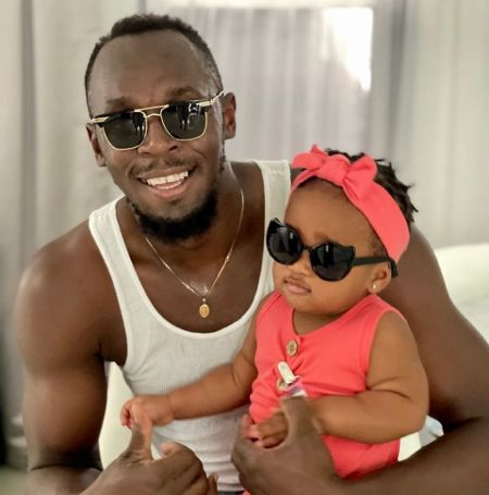 Usain Bolt and his first daughter Olympia Lightning Bolt.